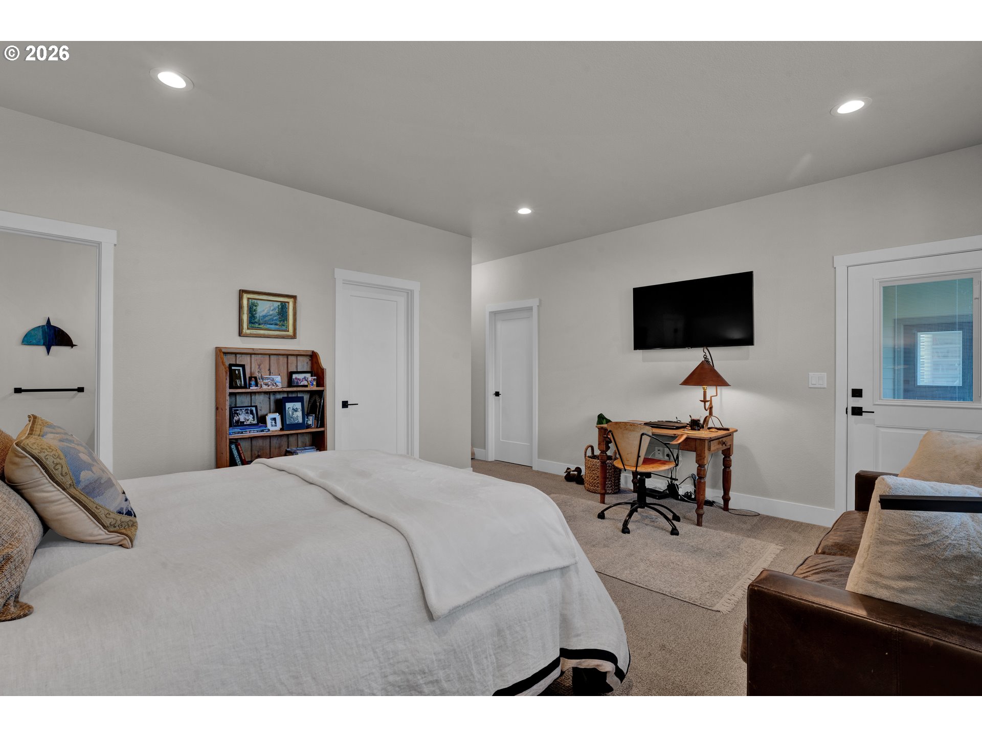 34 Bonnett Way Florence, OR 97439 - Photo 28 of 48 a bedroom with furniture and a flat screen tv