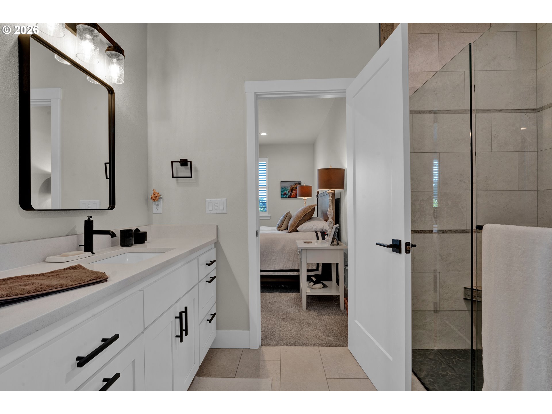34 Bonnett Way Florence, OR 97439 - Photo 30 of 48 a en suite bathroom with a double vanity sink a mirror and shower