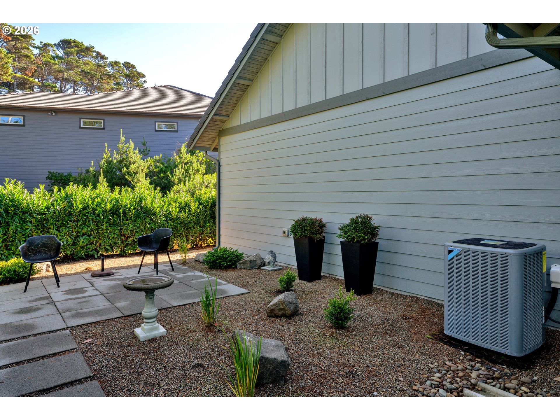 34 Bonnett Way Florence, OR 97439 - Photo 40 of 48 a backyard of a house with seating space