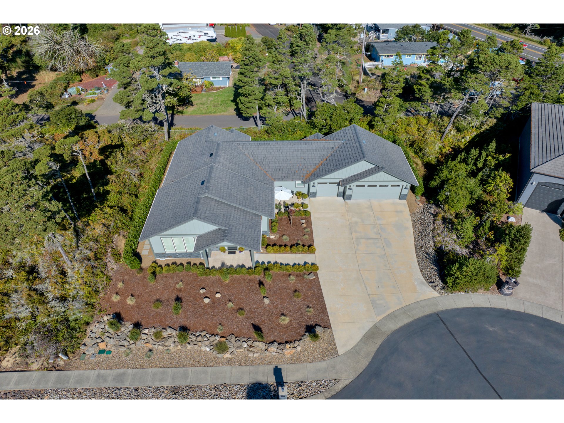 34 Bonnett Way Florence, OR 97439 - Photo 45 of 48 an aerial view of residential houses with outdoor space