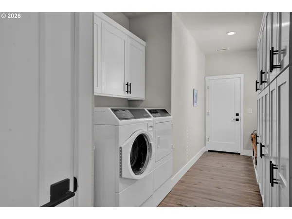 a view of a kitchen with washer and dryer