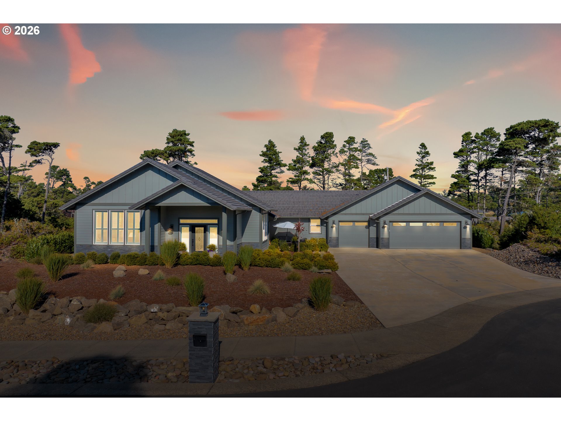 34 Bonnett Way Florence, OR 97439 - Photo 8 of 48 a view of a yard in front of a house with a large tree