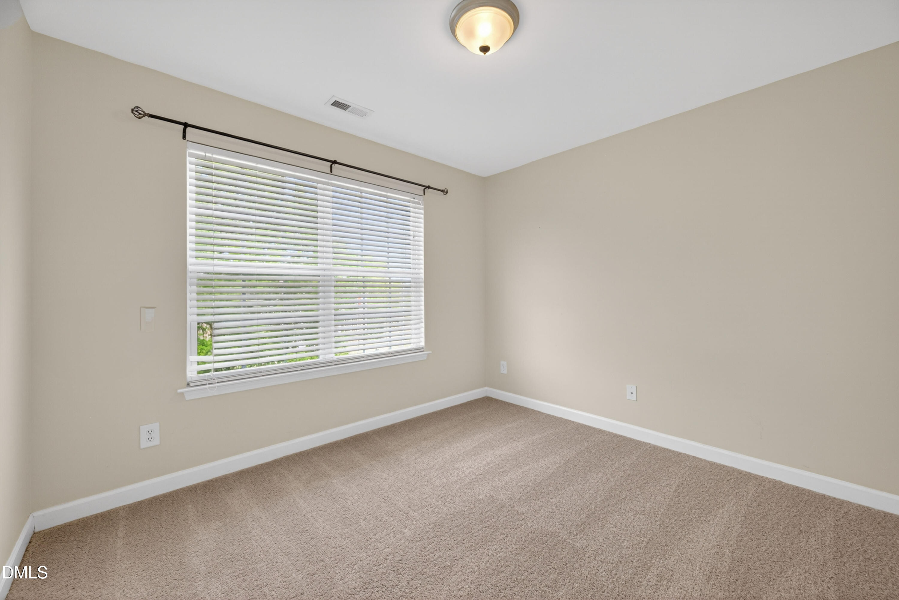 5304 Stone Station Drive Raleigh, NC 27616 - Photo 28 of 34 a view of an empty room with a window