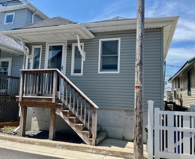 87 Bartlett Place Brooklyn, NY 11229 - Photo 1 of 20 a view of a house with wooden stairs