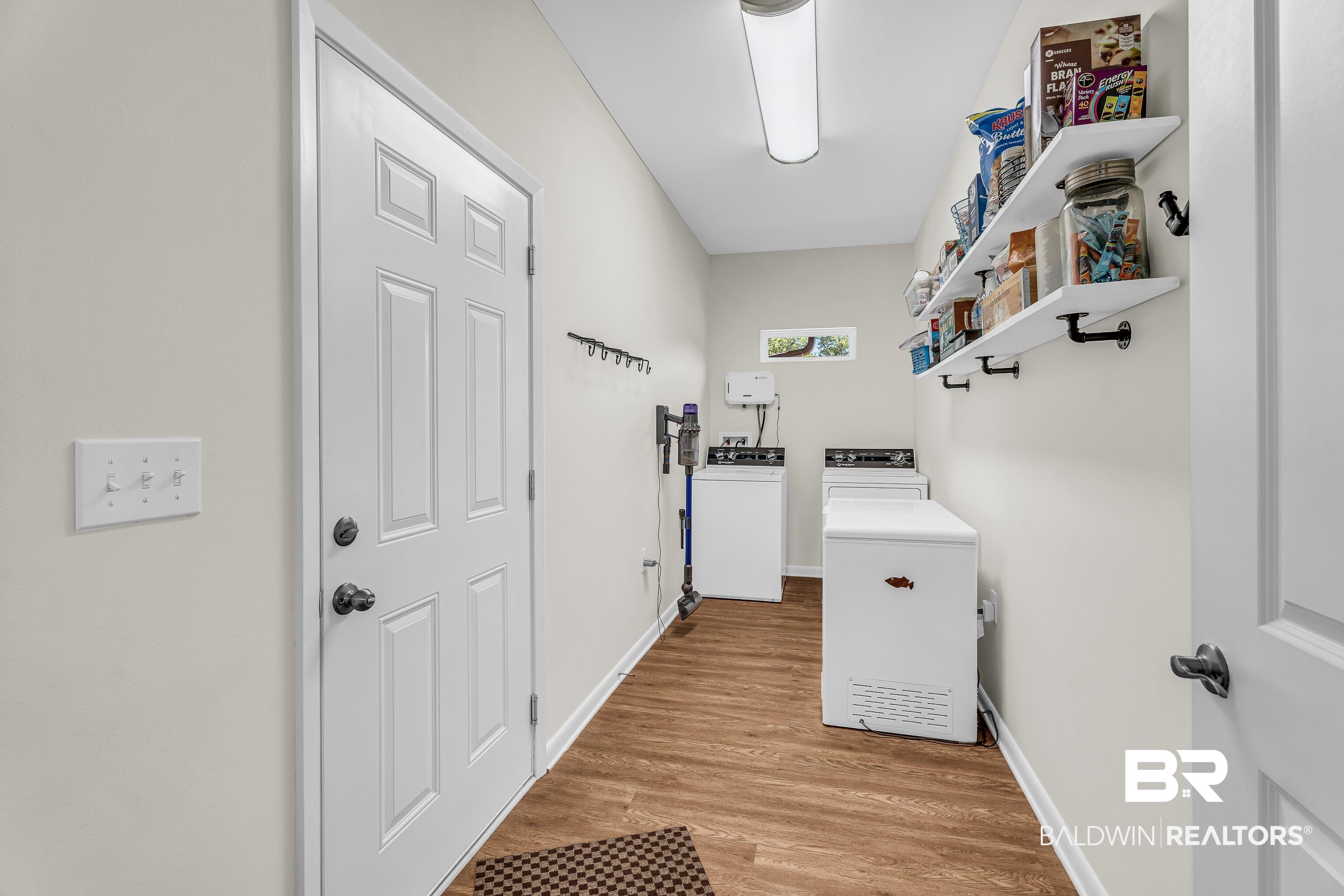 18255 Cactus Court Elberta, AL 36530 - Photo 22 of 53 Laundry area with light wood-style floors and washing machine and clothes dryer