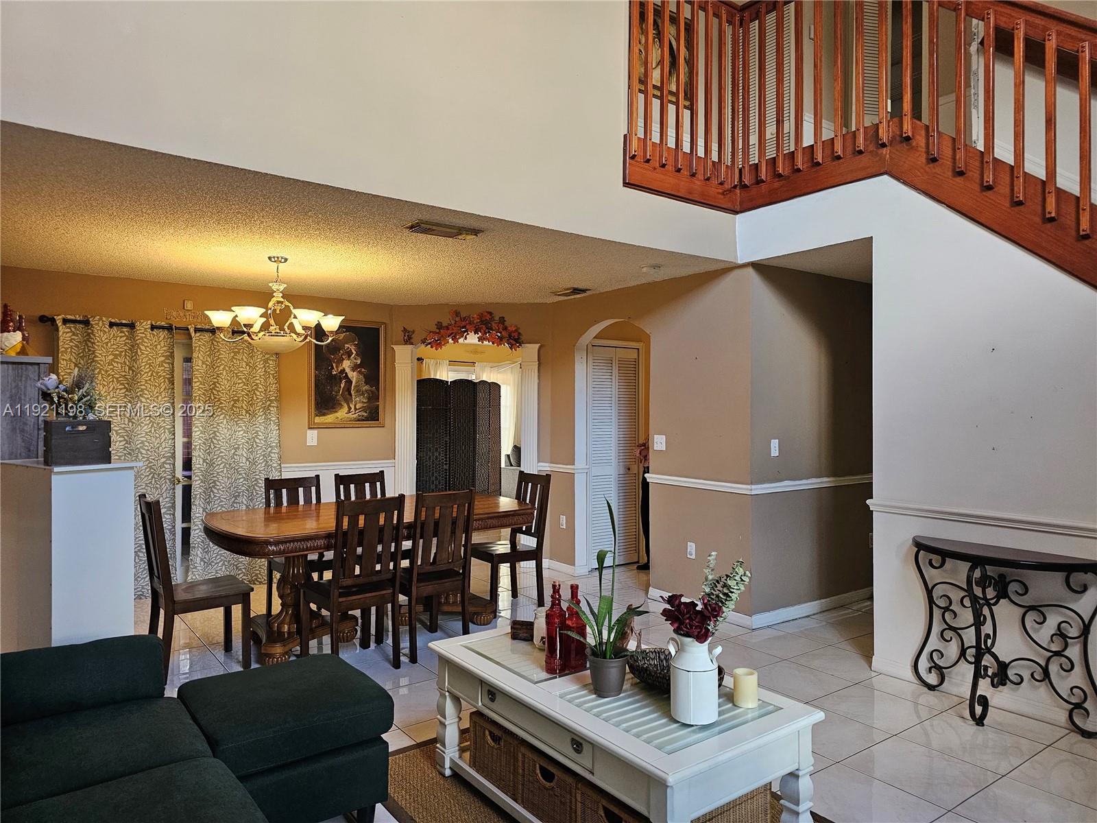 10816 Southwest 75th Street Miami, FL 33173 - Photo 2 of 20 a dining room with furniture and wooden floor