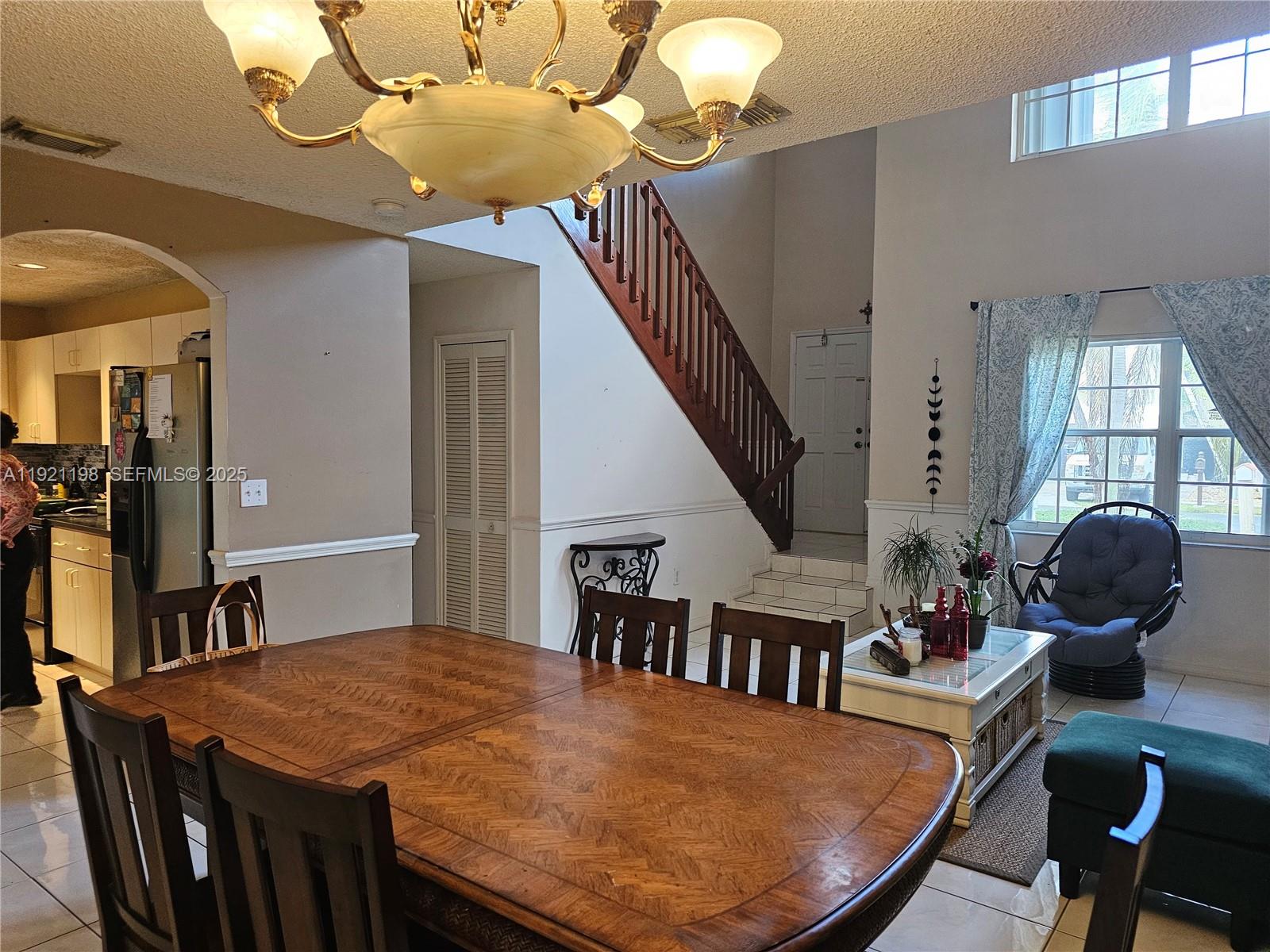 10816 Southwest 75th Street Miami, FL 33173 - Photo 4 of 20 a view of a dining room with furniture and wooden floor