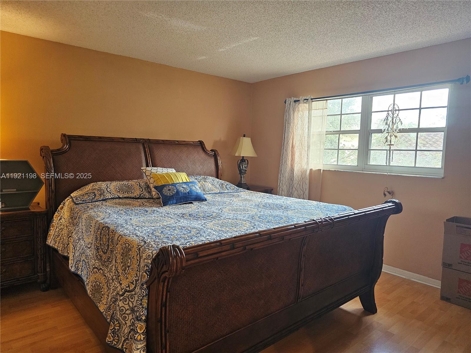 10816 Southwest 75th Street Miami, FL 33173 - Photo 9 of 20 a bedroom with a bed and window