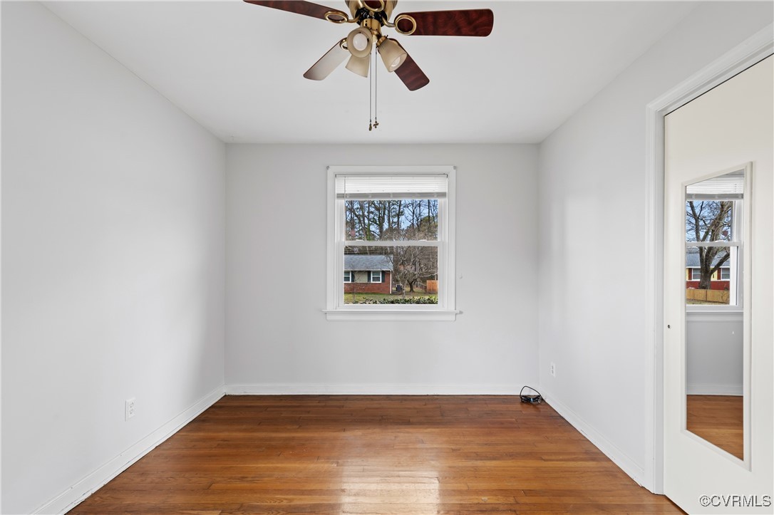 9707 Esmont Road Henrico, VA 23228 - Photo 36 of 50 Empty room with wood finished floors, a ceiling fa
