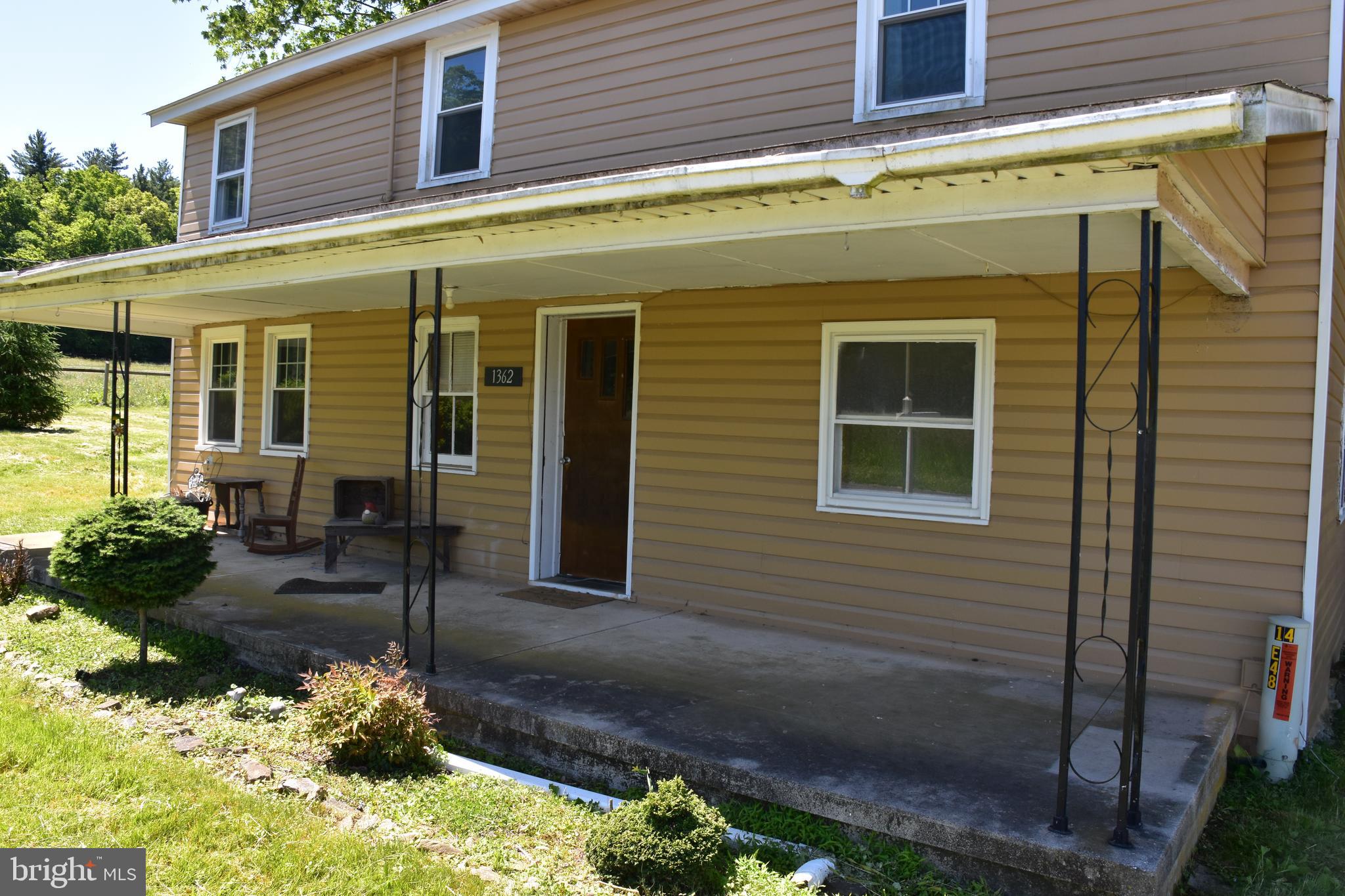 1362 New Road Orrtanna, PA 17353 - Photo 3 of 28 a front view of a house with a yard