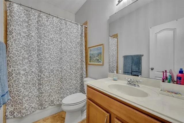 a kitchen with granite countertop a sink and cabinets