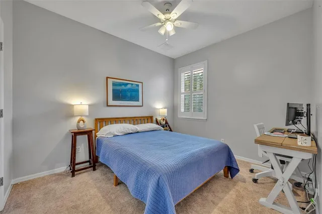 a bed room with a bed and a lamp