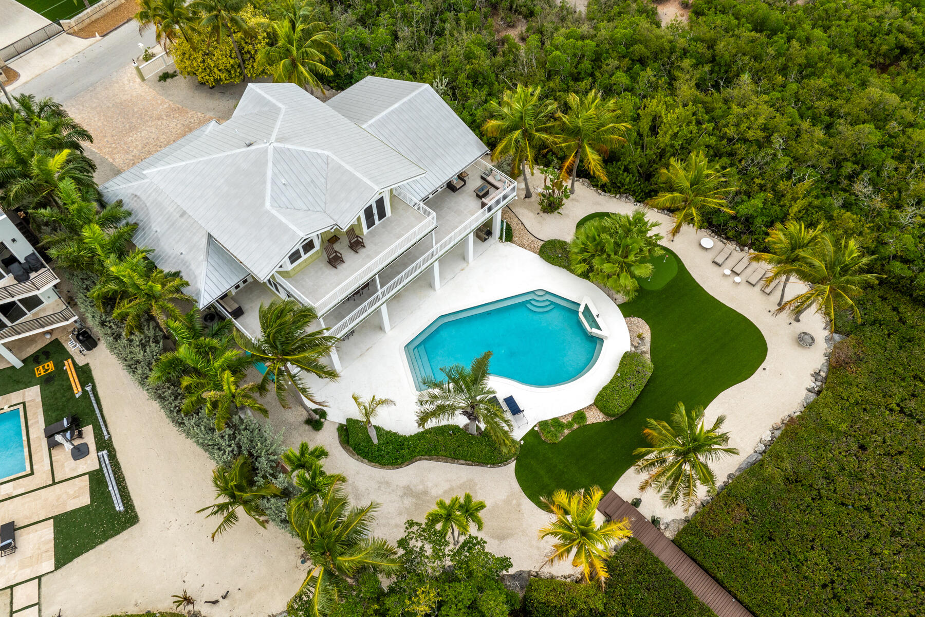 51 Mutiny Place Key Largo, FL 33037 - Photo 11 of 75 an aerial view of a house with a swimming pool