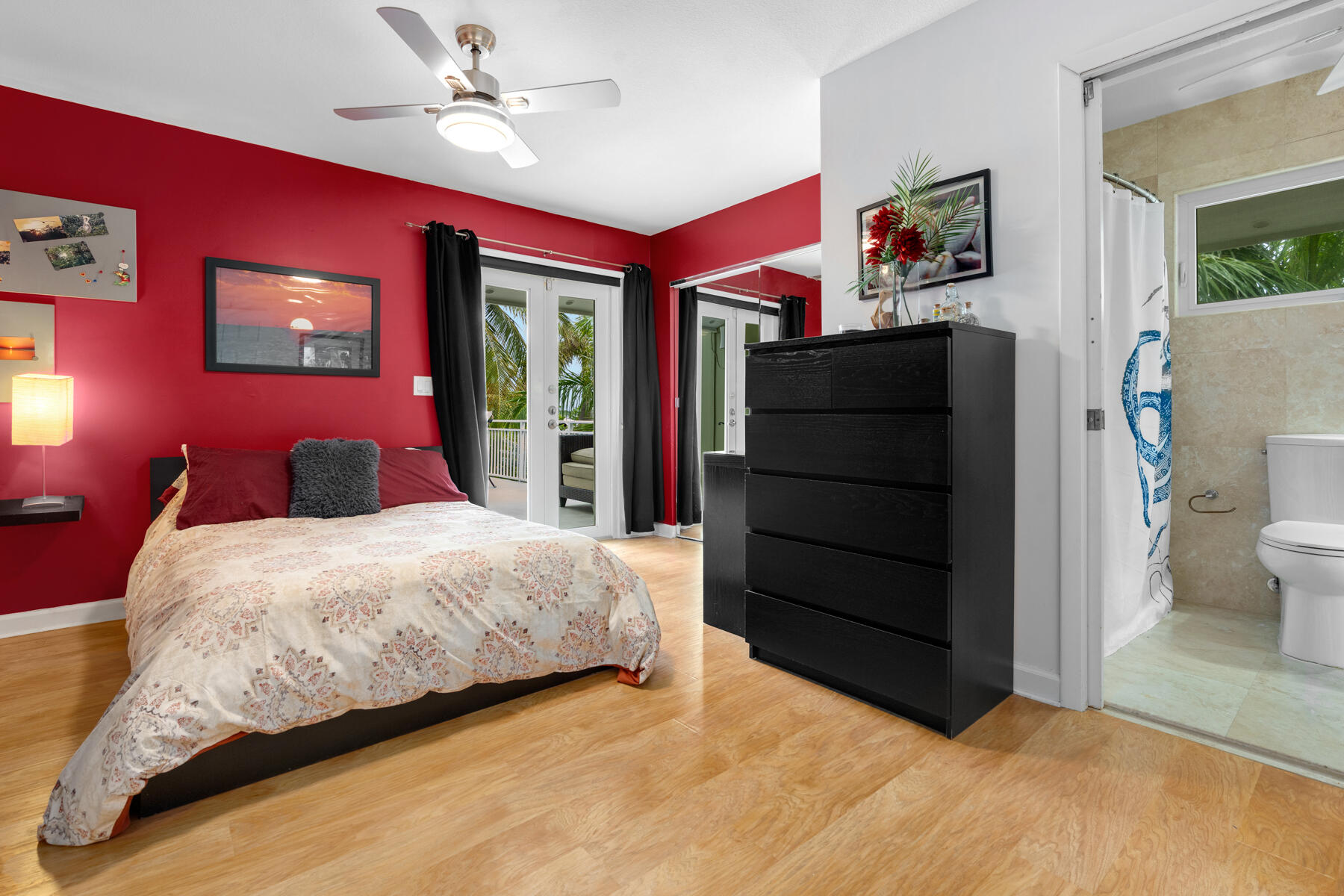 51 Mutiny Place Key Largo, FL 33037 - Photo 39 of 75 a bedroom with a bed and wooden floor