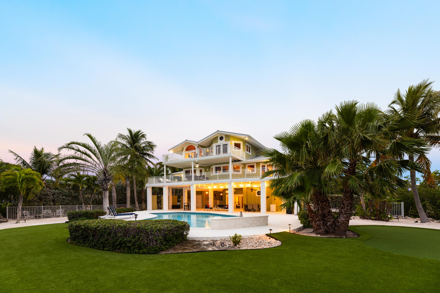 51 Mutiny Place Key Largo, FL 33037 - Photo 56 of 75 a front view of a house with garden and trees