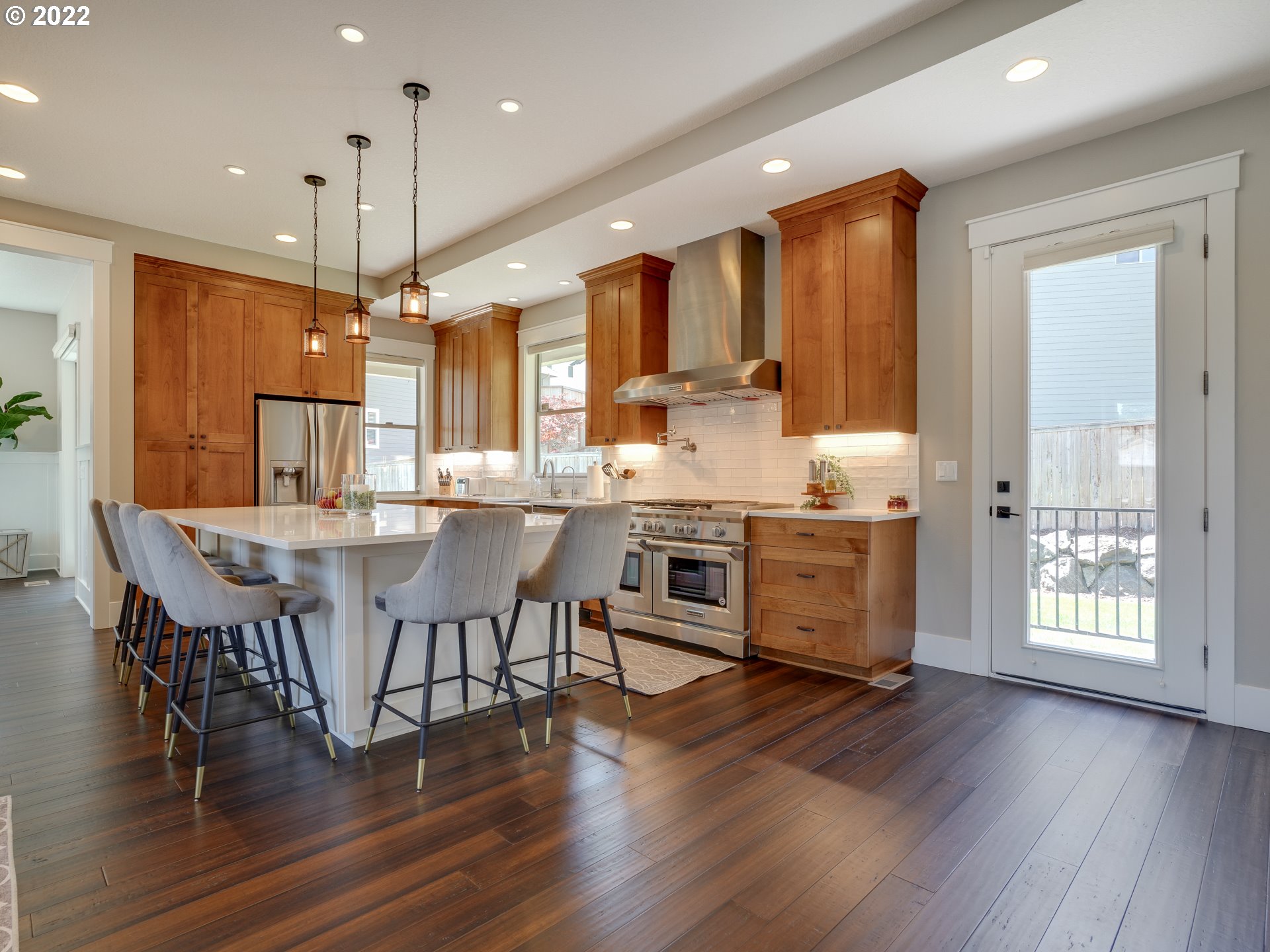 701 South 19th Place Ridgefield, WA 98642 - Photo 5 of 32 a large kitchen with a table and chairs