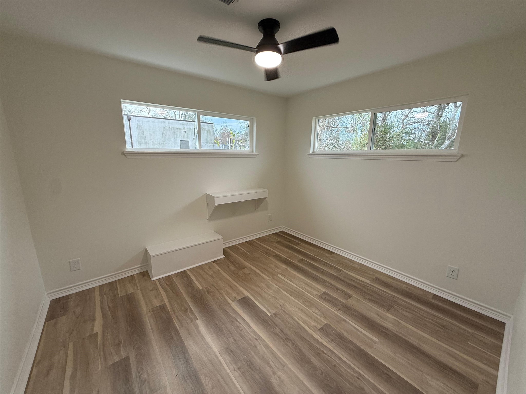 6210 Delany Road Hitchcock, TX 77563 - Photo 8 of 12 a view of empty room with wooden floor and fan