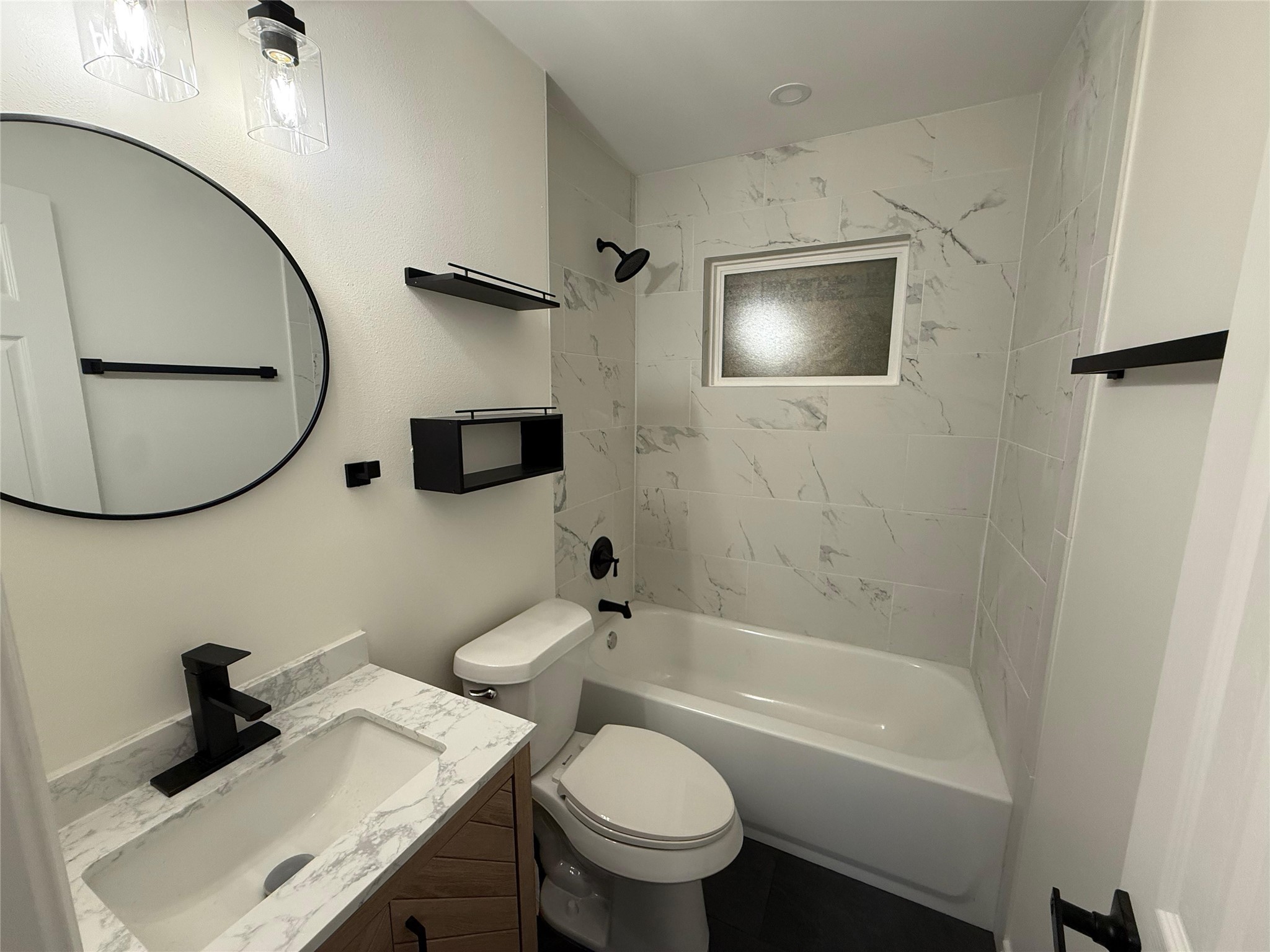 6210 Delany Road Hitchcock, TX 77563 - Photo 9 of 12 a bathroom with a sink a toilet and a mirror