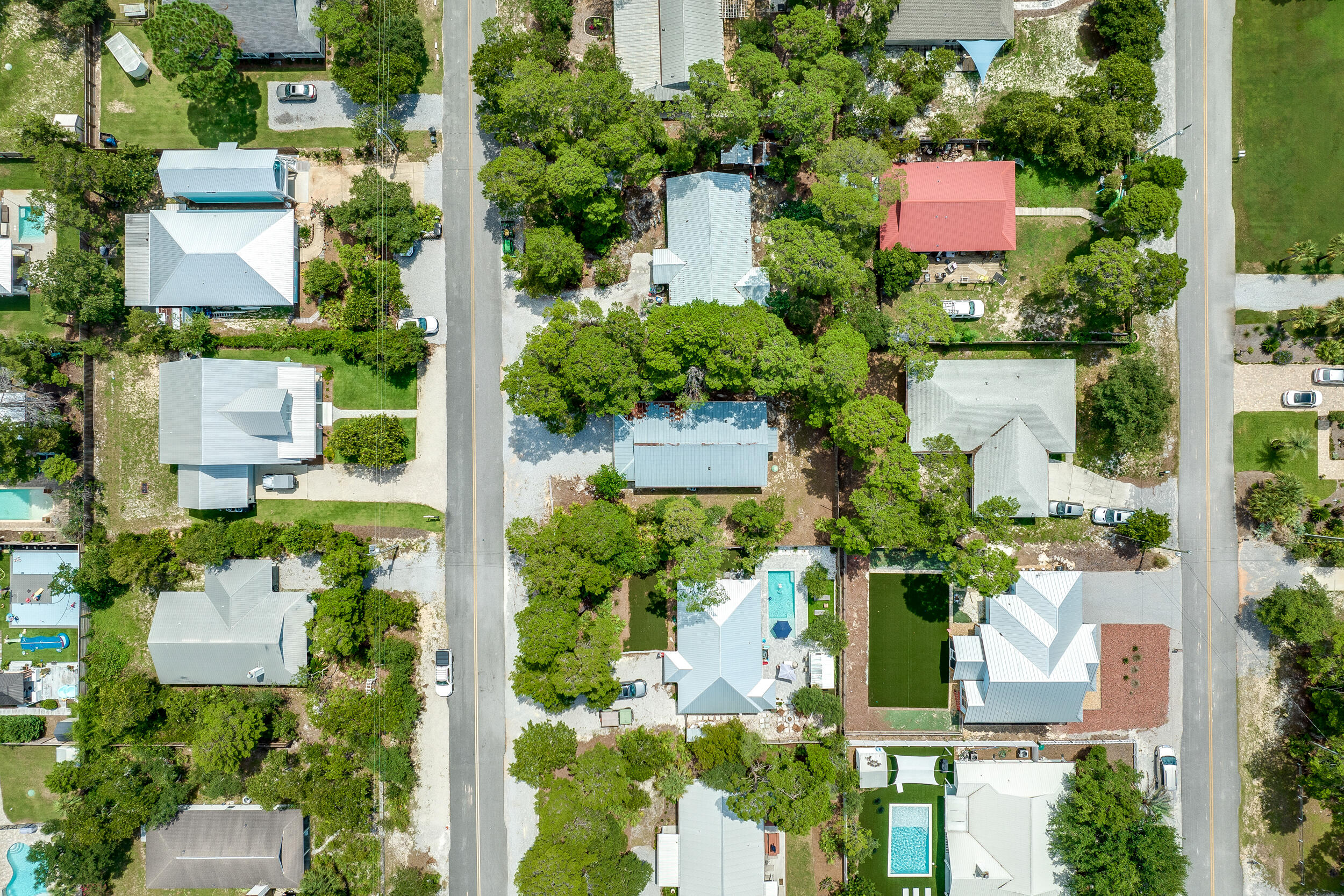 78 Walnut Street Santa Rosa Beach, FL 32459 - Photo 29 of 34 an aerial view of a house with a yard and lake view