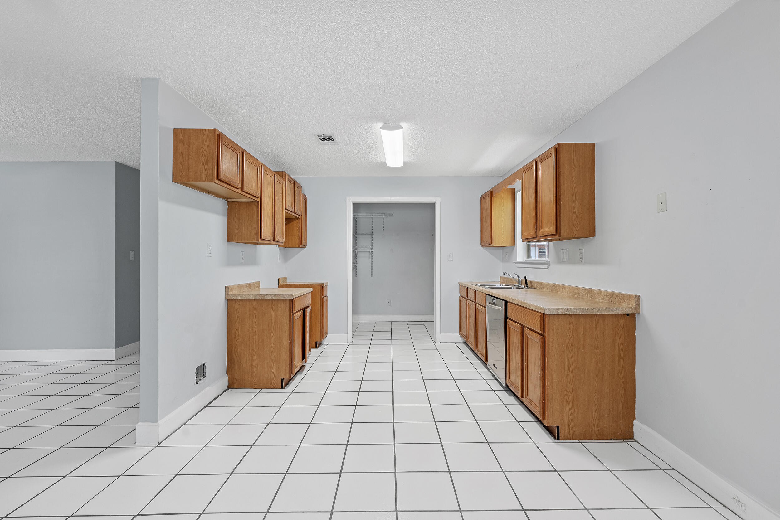 78 Walnut Street Santa Rosa Beach, FL 32459 - Photo 7 of 34 a view of a kitchen with sink and washing machine