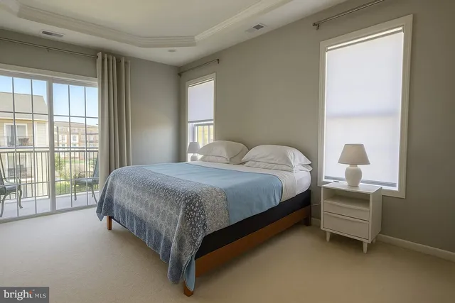 a spacious bedroom with a bed and window