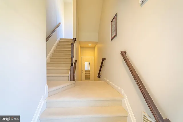 a view of a hallway with staircase