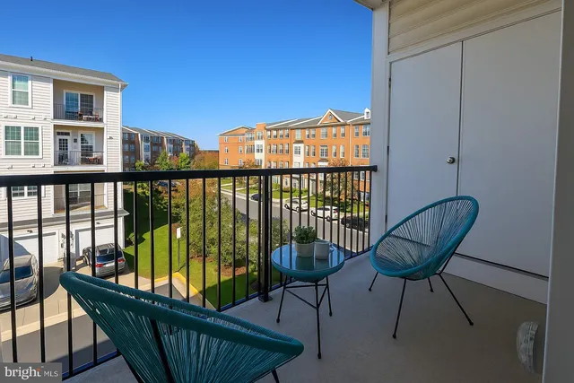 a view of a balcony with chairs