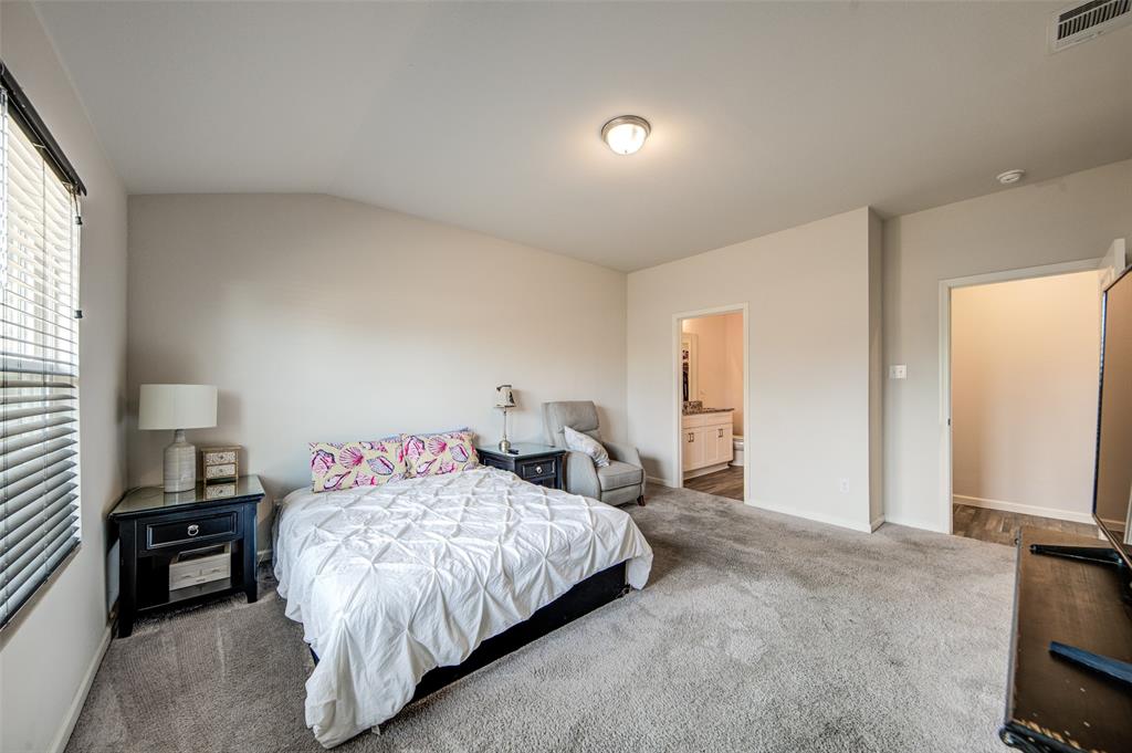905 Avagail Avenue Springtown, TX 76082 - Photo 19 of 26 Bedroom featuring carpet floors, connected bathroom, and lofted ceiling