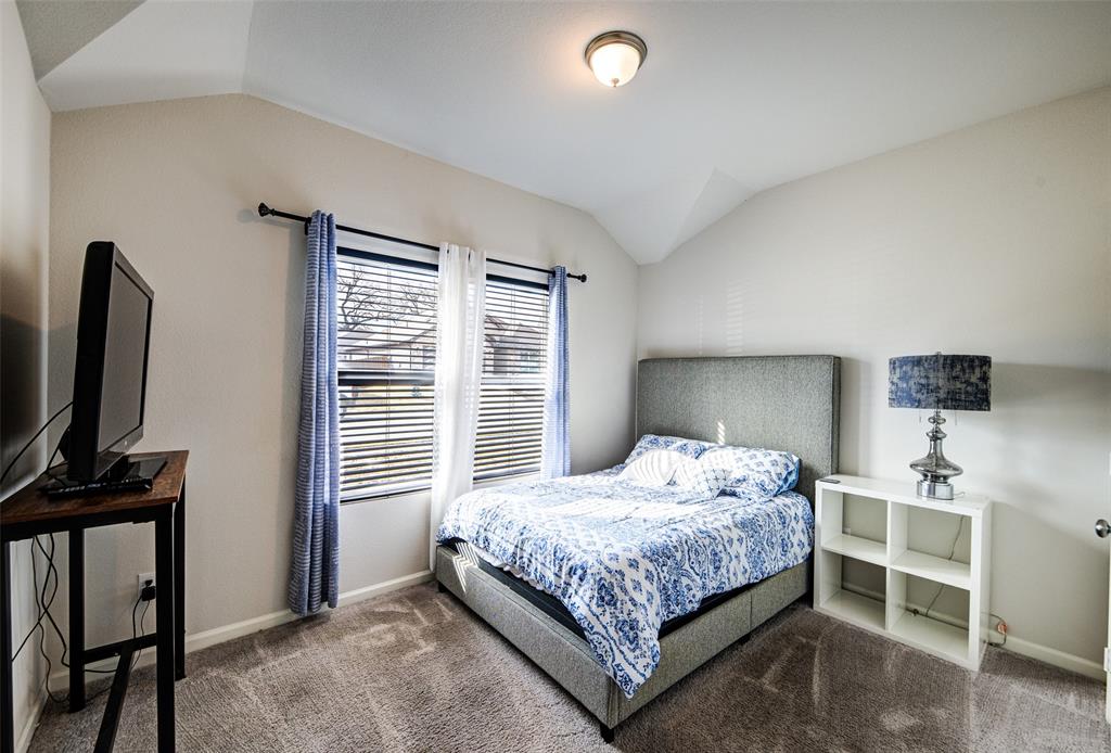 905 Avagail Avenue Springtown, TX 76082 - Photo 5 of 26 Carpeted bedroom featuring vaulted ceiling and baseboards