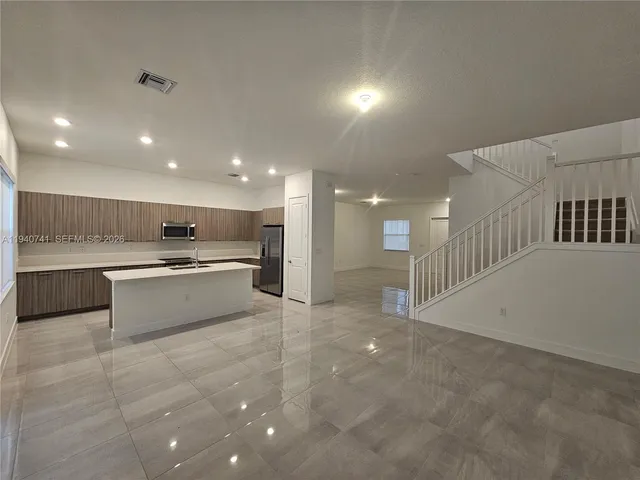 a view of hallway with bathroom