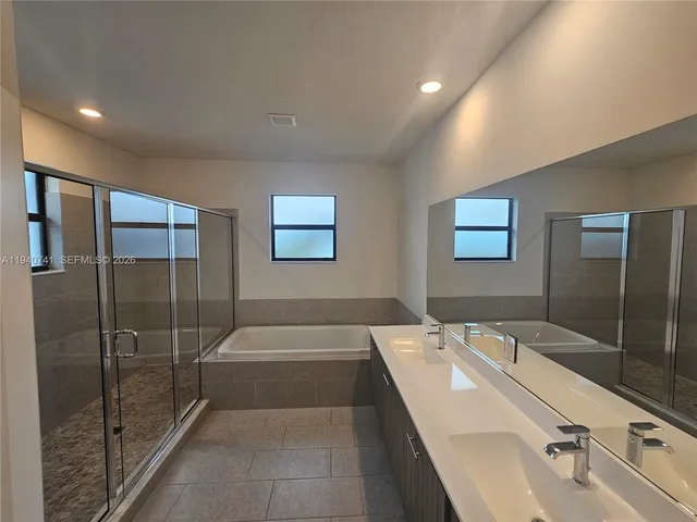 a bathroom with a shower and bathtub
