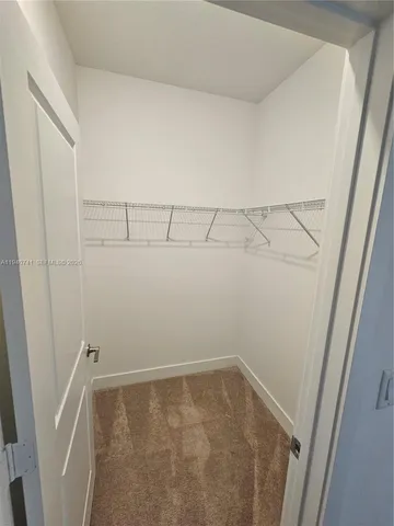 an empty room with a bathroom