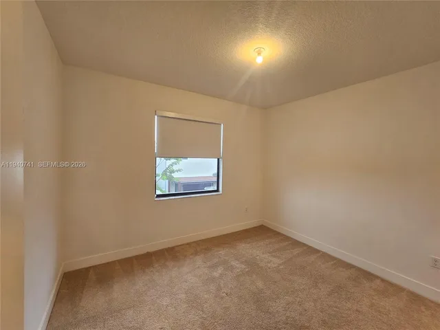 a view of a storage & utility room with a window