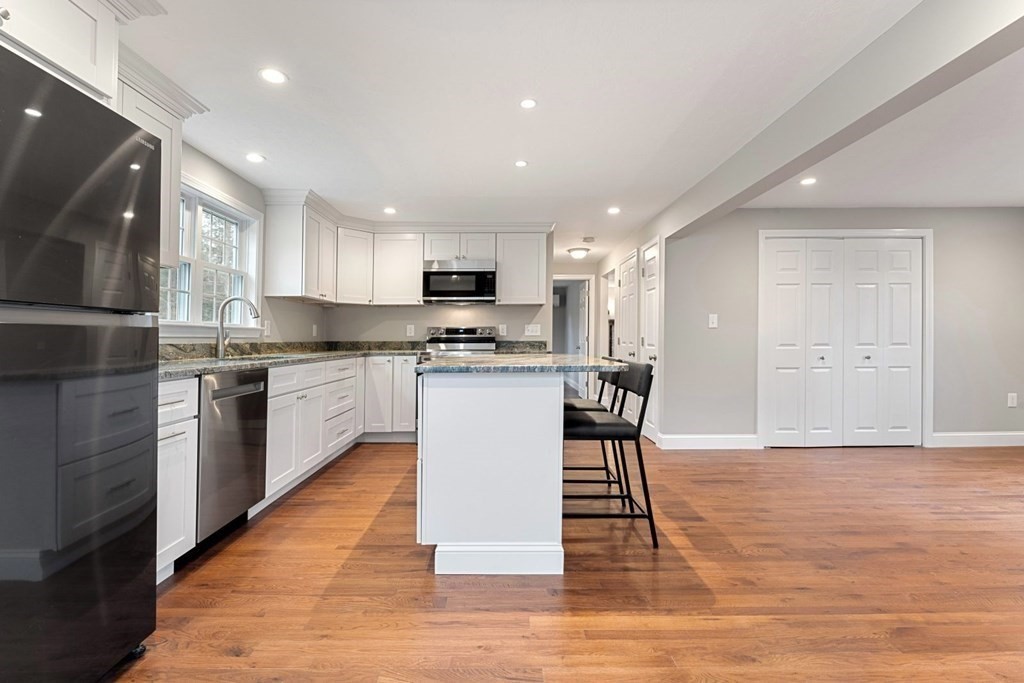 1069 Main Street Dunstable, MA 01827 - Photo 14 of 41 a kitchen with a sink a counter top space cabinets and stainless steel appliances