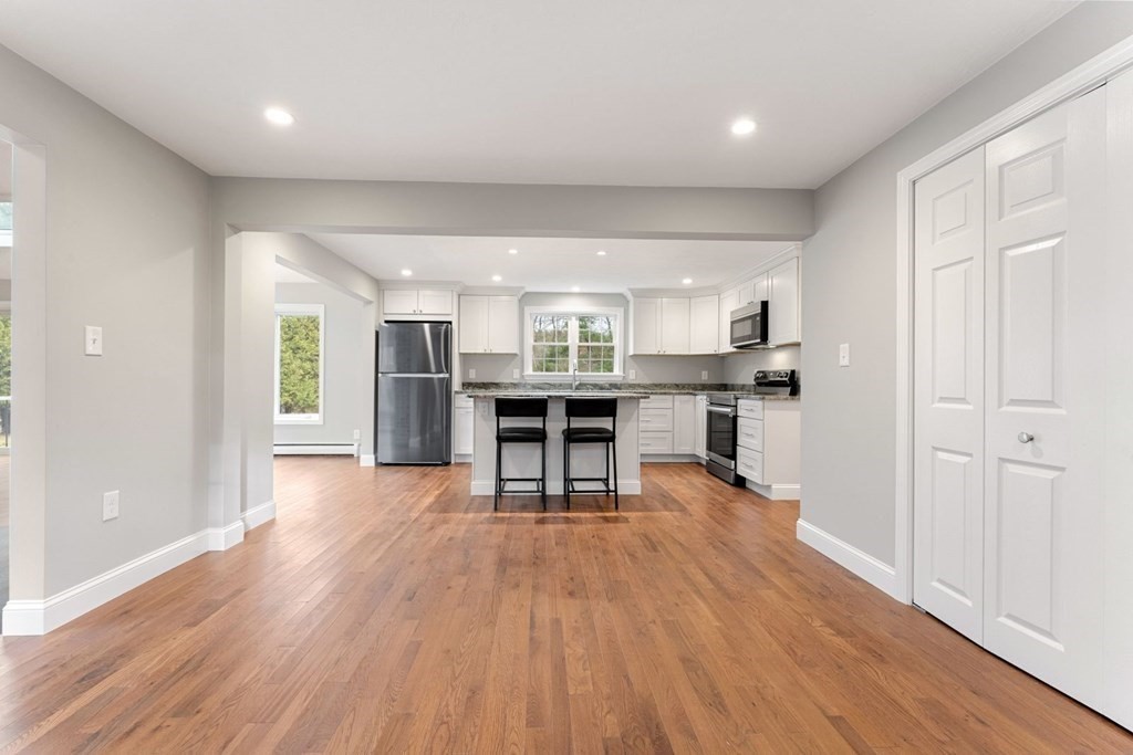 1069 Main Street Dunstable, MA 01827 - Photo 16 of 41 a view of a kitchen with furniture and wooden floor