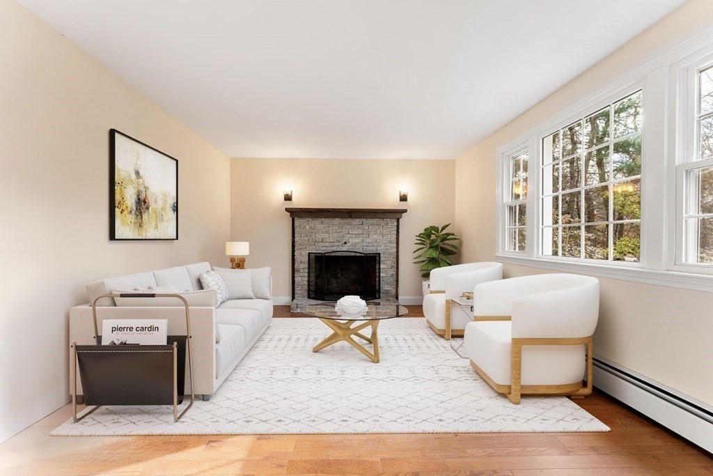 1069 Main Street Dunstable, MA 01827 - Photo 18 of 41 a living room with furniture and a fireplace