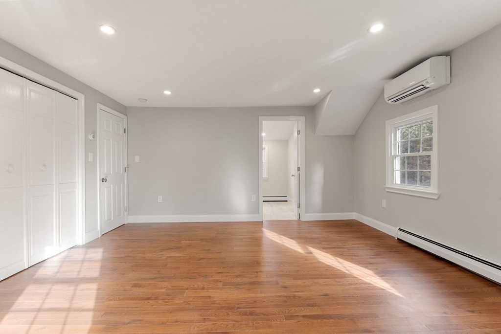 1069 Main Street Dunstable, MA 01827 - Photo 22 of 41 a view of an empty room with wooden floor and a window