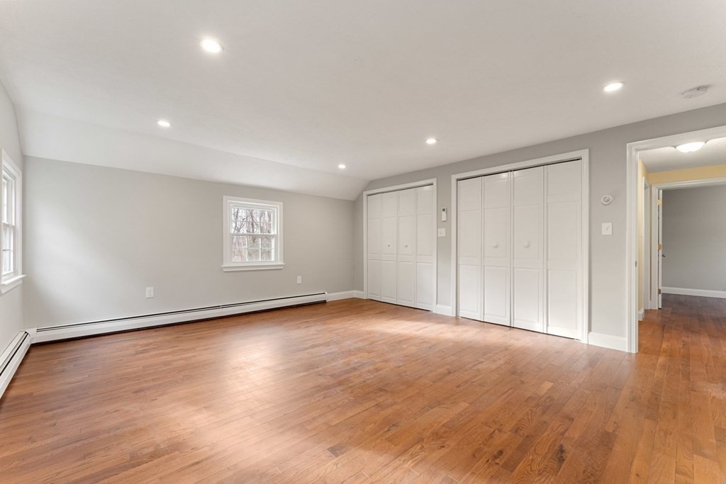 1069 Main Street Dunstable, MA 01827 - Photo 27 of 41 a view of an empty room with wooden floor and a window