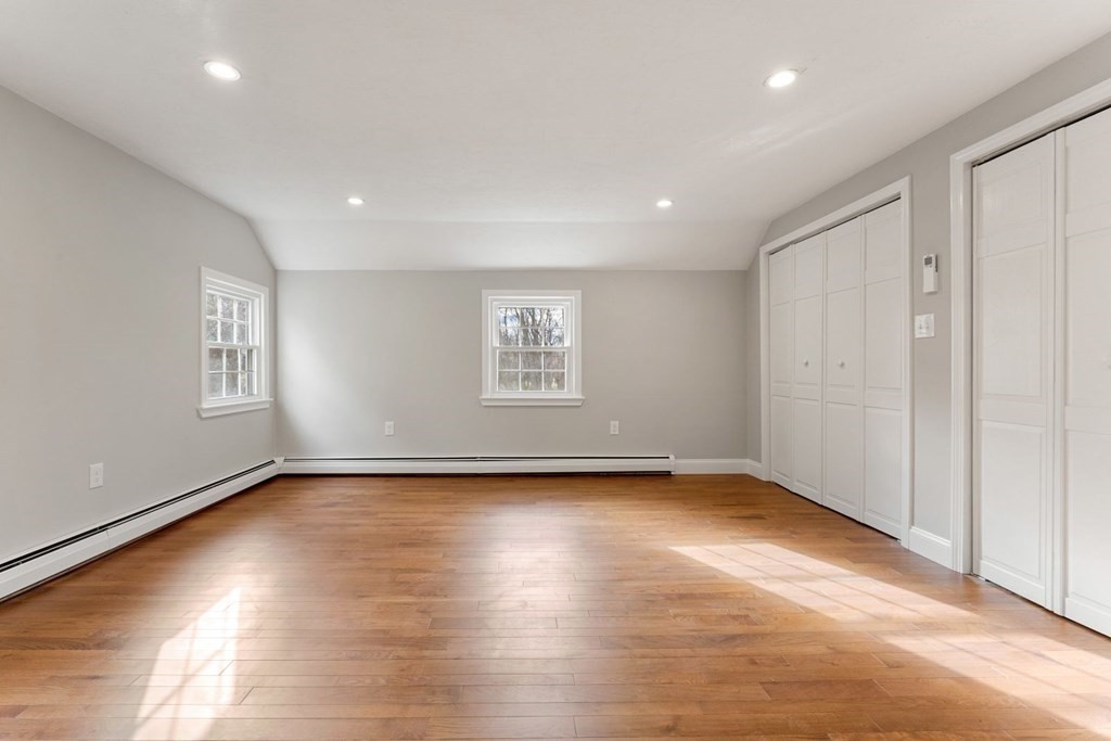 1069 Main Street Dunstable, MA 01827 - Photo 28 of 41 an empty room with wooden floor and windows