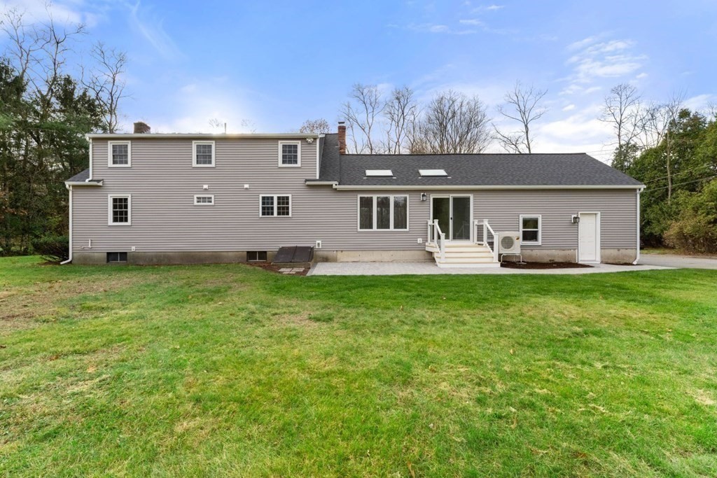 1069 Main Street Dunstable, MA 01827 - Photo 32 of 41 front view of a house with a yard