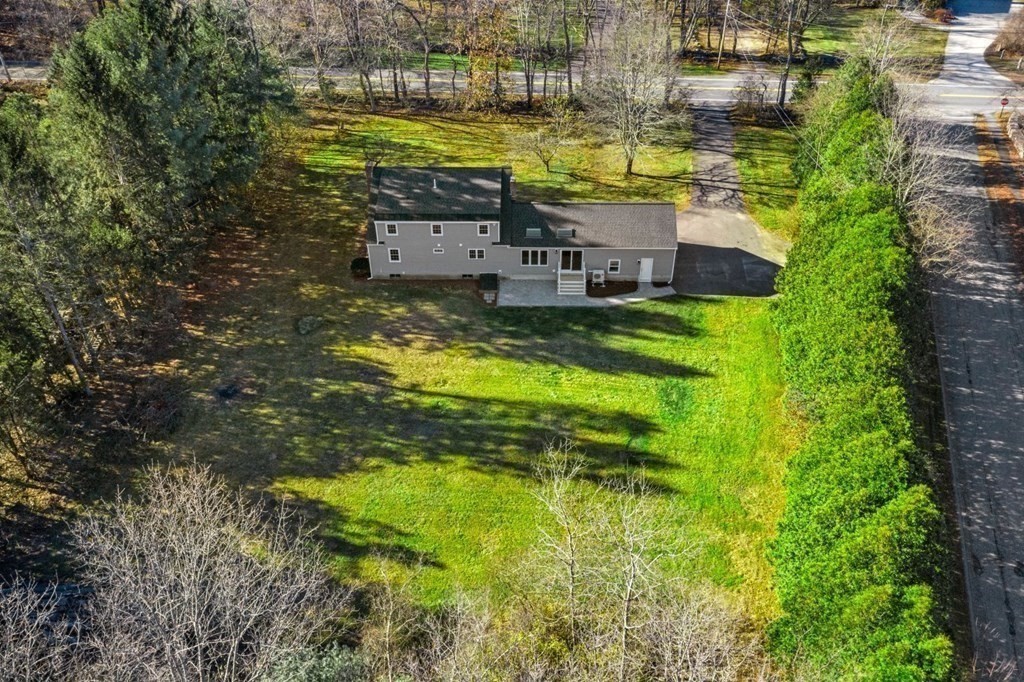 1069 Main Street Dunstable, MA 01827 - Photo 37 of 41 a view of a house with a swimming pool