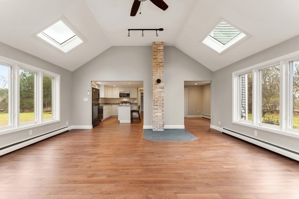 1069 Main Street Dunstable, MA 01827 - Photo 5 of 41 a view of an empty room with a window and wooden floor