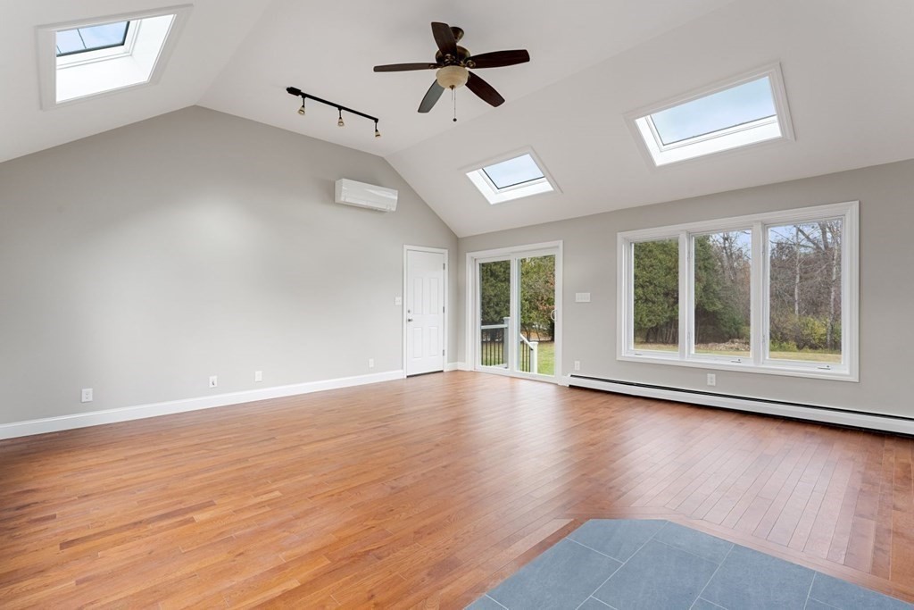 1069 Main Street Dunstable, MA 01827 - Photo 6 of 41 a view of an empty room with wooden floor and a window