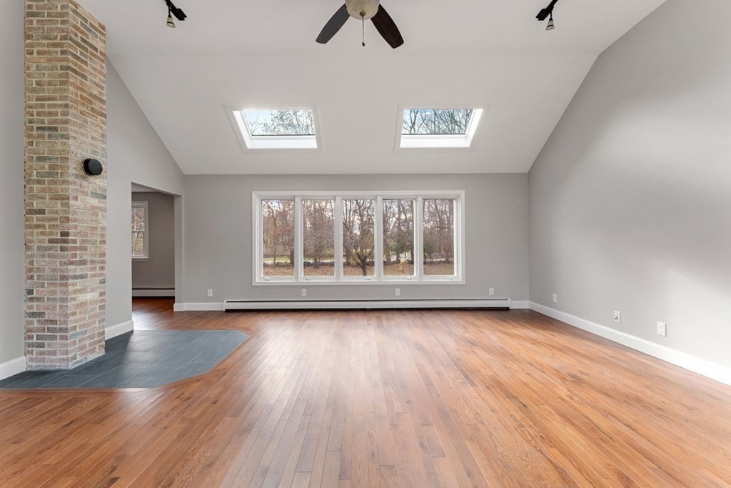 1069 Main Street Dunstable, MA 01827 - Photo 8 of 41 wooden floor in an empty room with a window