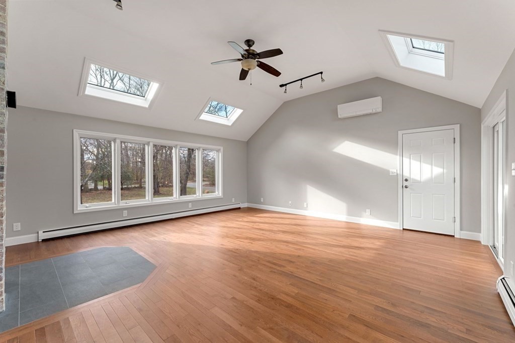 1069 Main Street Dunstable, MA 01827 - Photo 9 of 41 a view of an empty room with a window and wooden floor