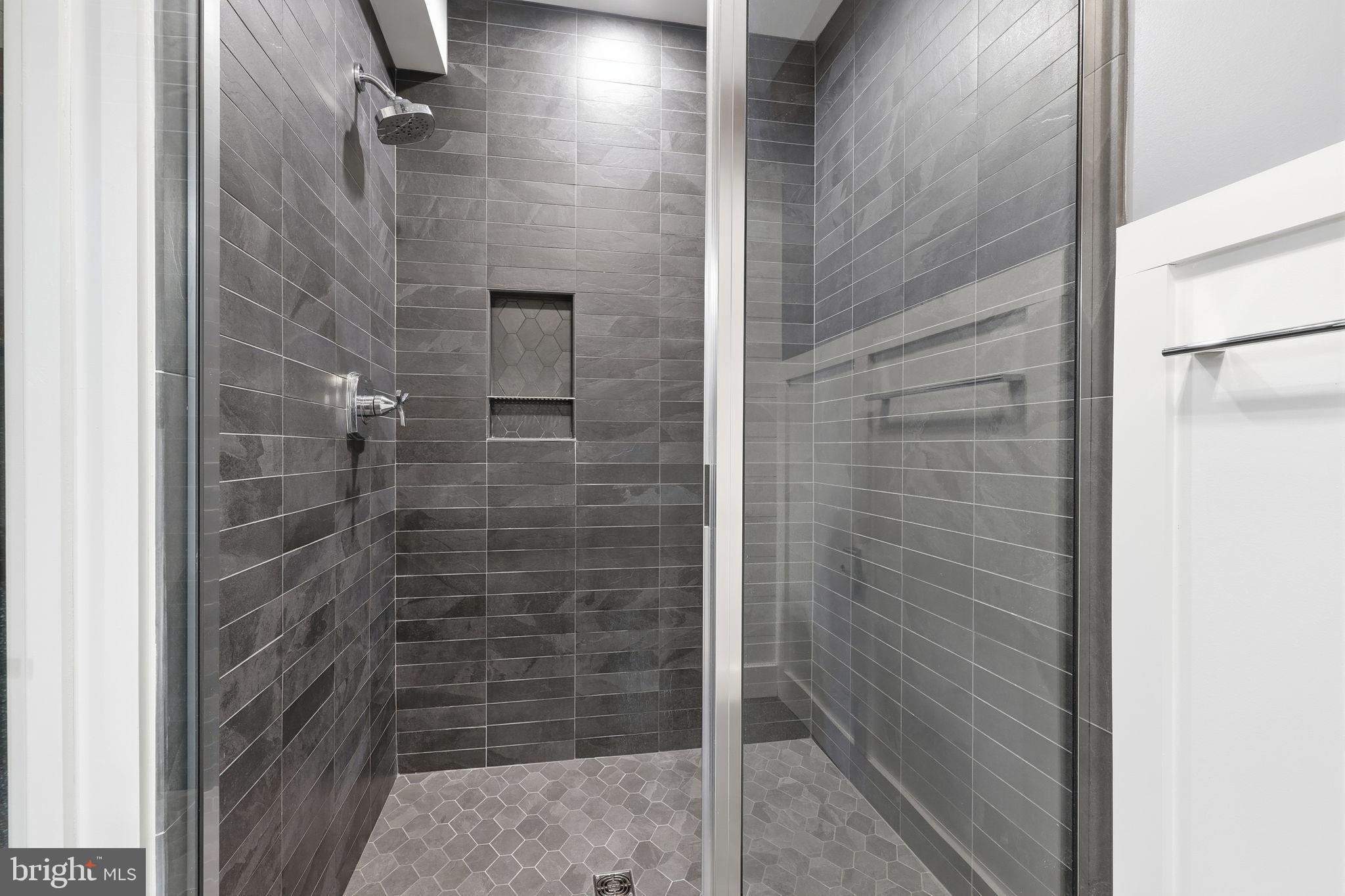 176 Fenstermaker Road Kutztown, PA 19530 - Photo 108 of 149 Sleek modern shower with elegant tile design.