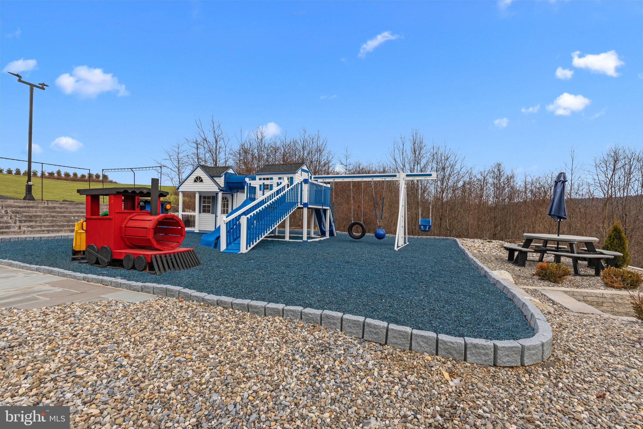 176 Fenstermaker Road Kutztown, PA 19530 - Photo 134 of 149 Colorful playground with train and swings.