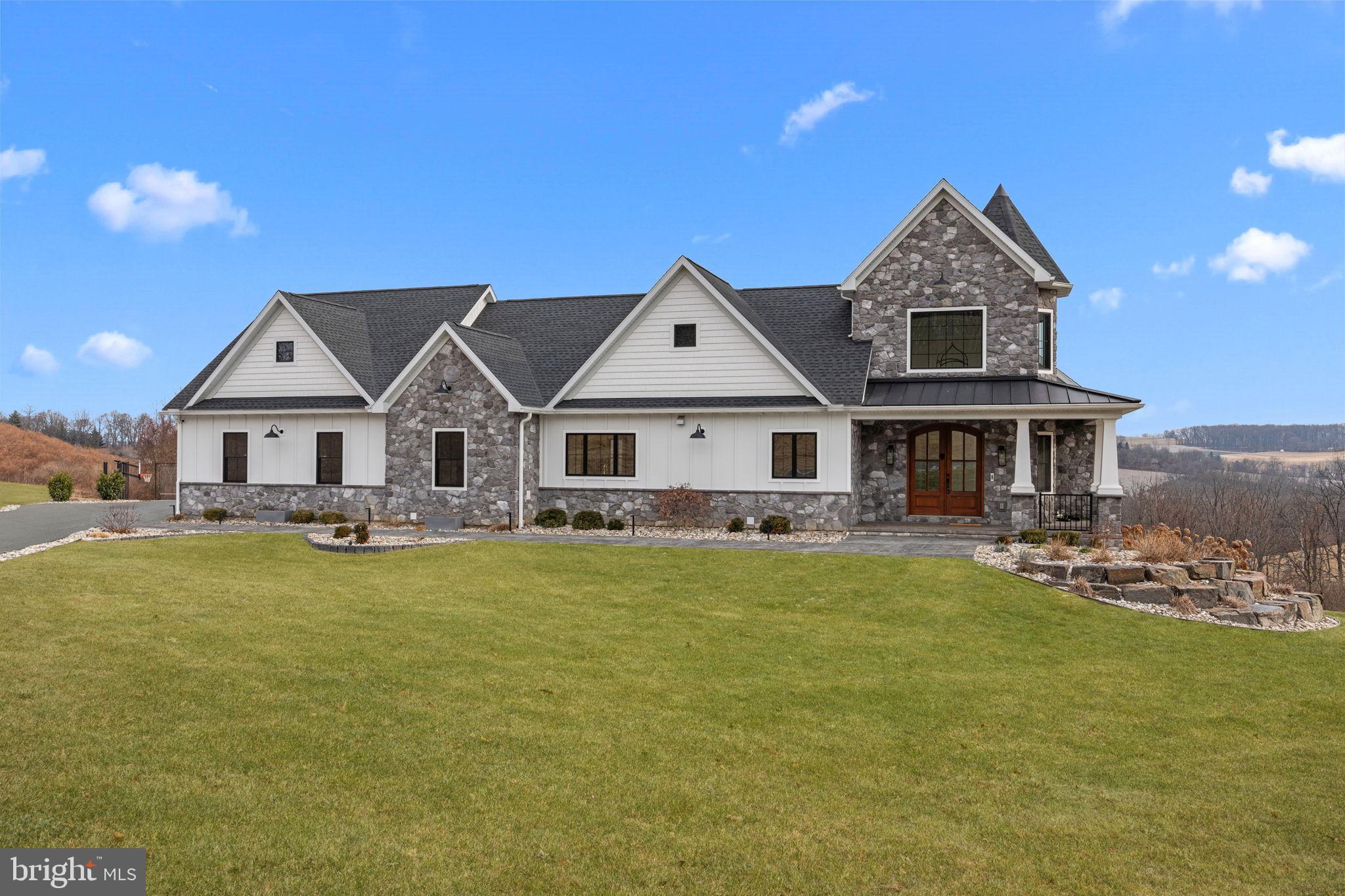 176 Fenstermaker Road Kutztown, PA 19530 - Photo 2 of 149 Elegant stone-clad home with scenic views.