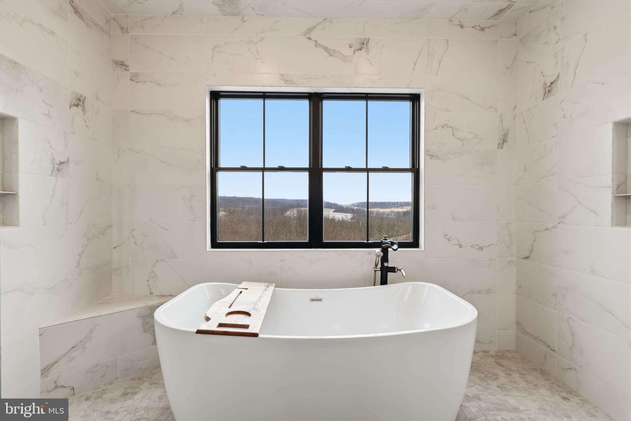 176 Fenstermaker Road Kutztown, PA 19530 - Photo 27 of 149 a white bath tub sitting next to a window