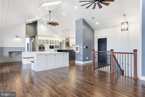 a view of kitchen with stainless steel appliances and cabinets